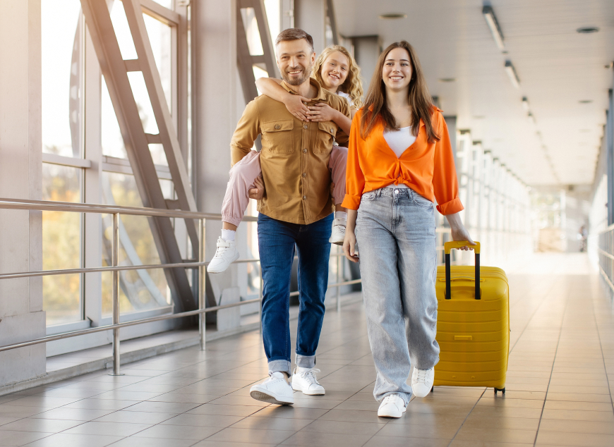 A family walking though an airport